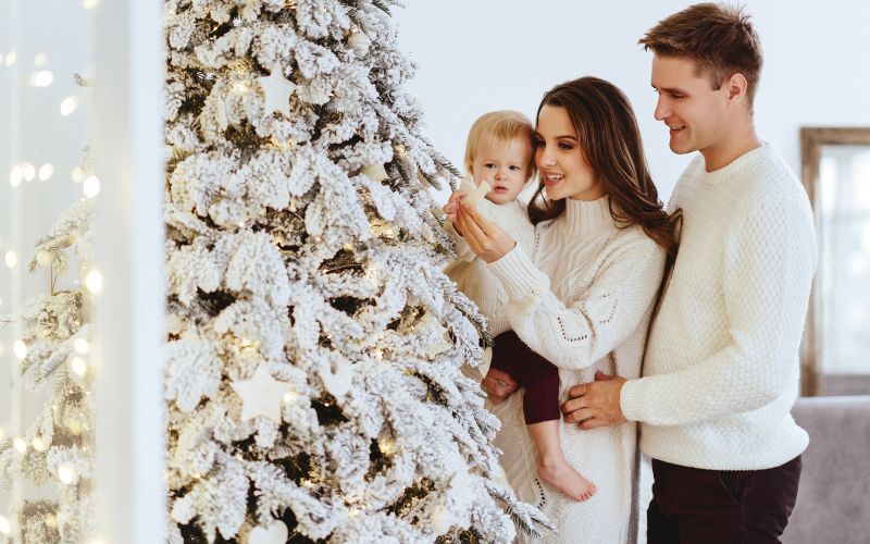 Family looking at their Christmas tree