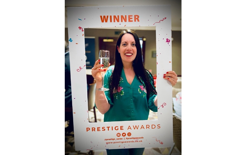 Award Winning Sleep Consultant 5 Naomi with a glass of champagne at the event