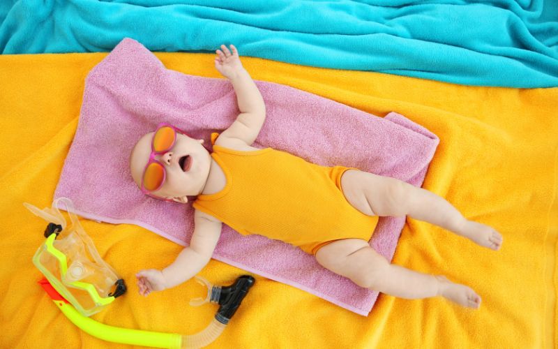 Baby sleep on holiday 6 Baby laying out with sunglasses on